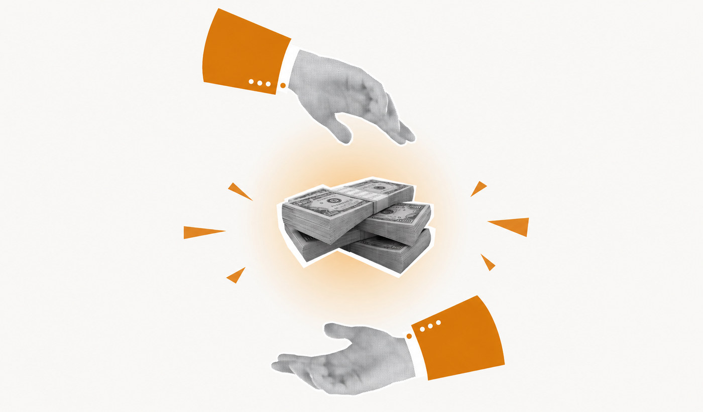 Two hands in orange sleeves passing a stack of banknotes