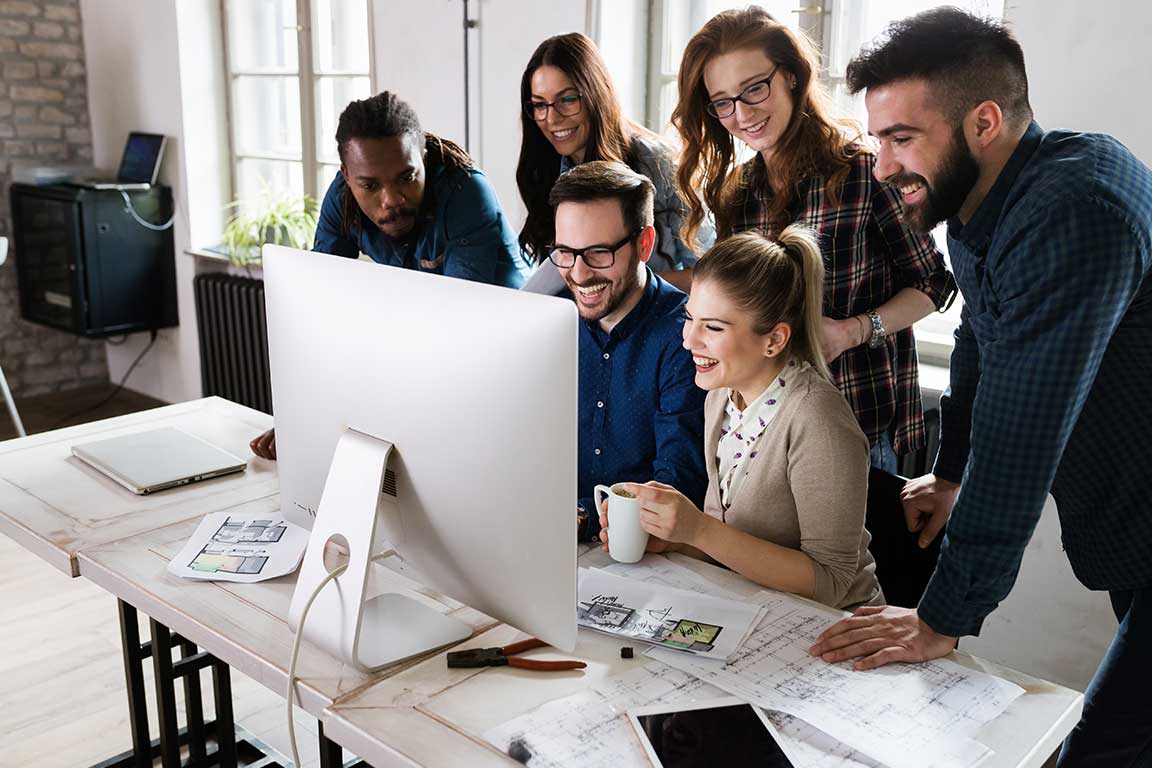 The Primie Global team reviewing marketplace performance